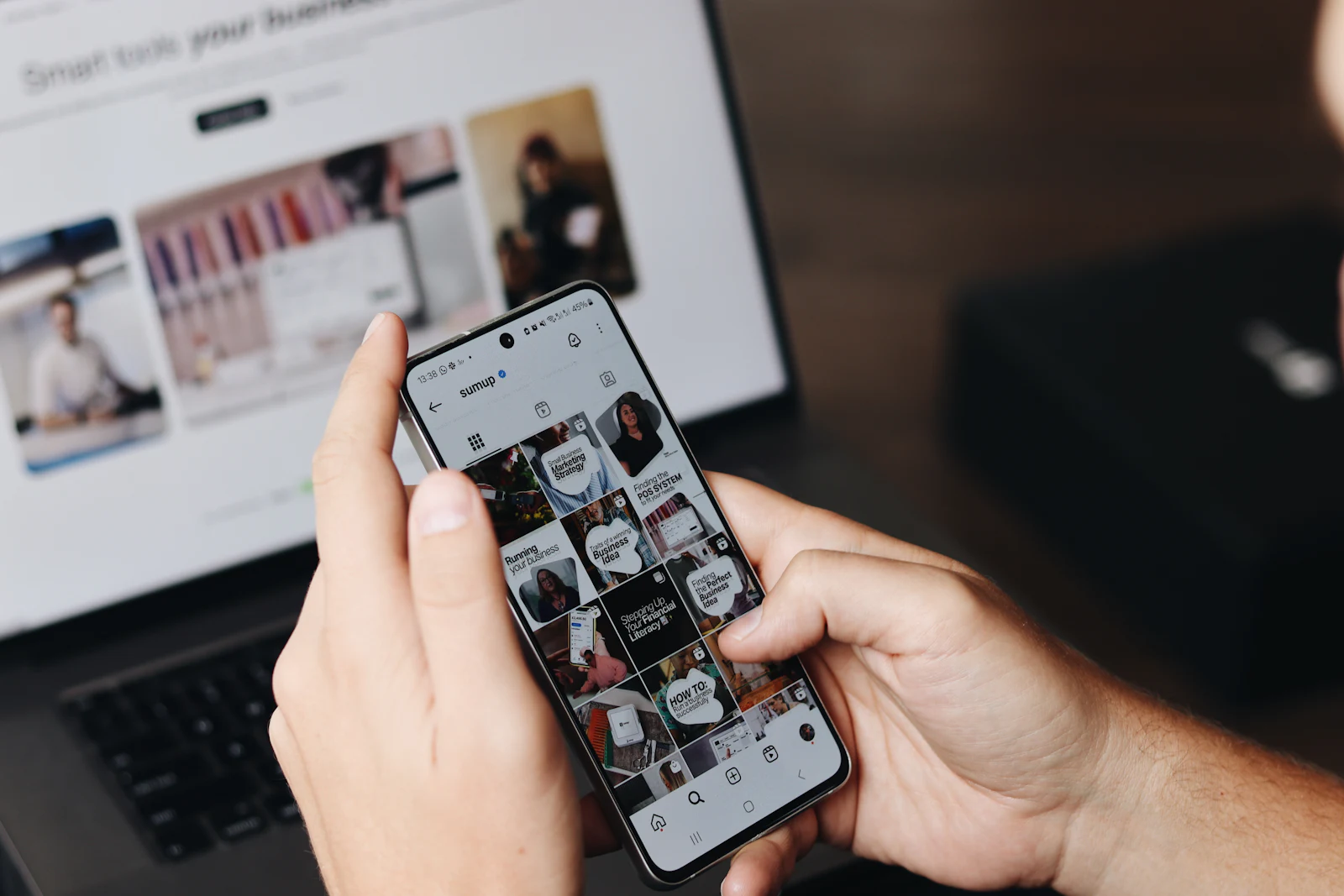 Social media manager reviewing a branded content feed on a smartphone
