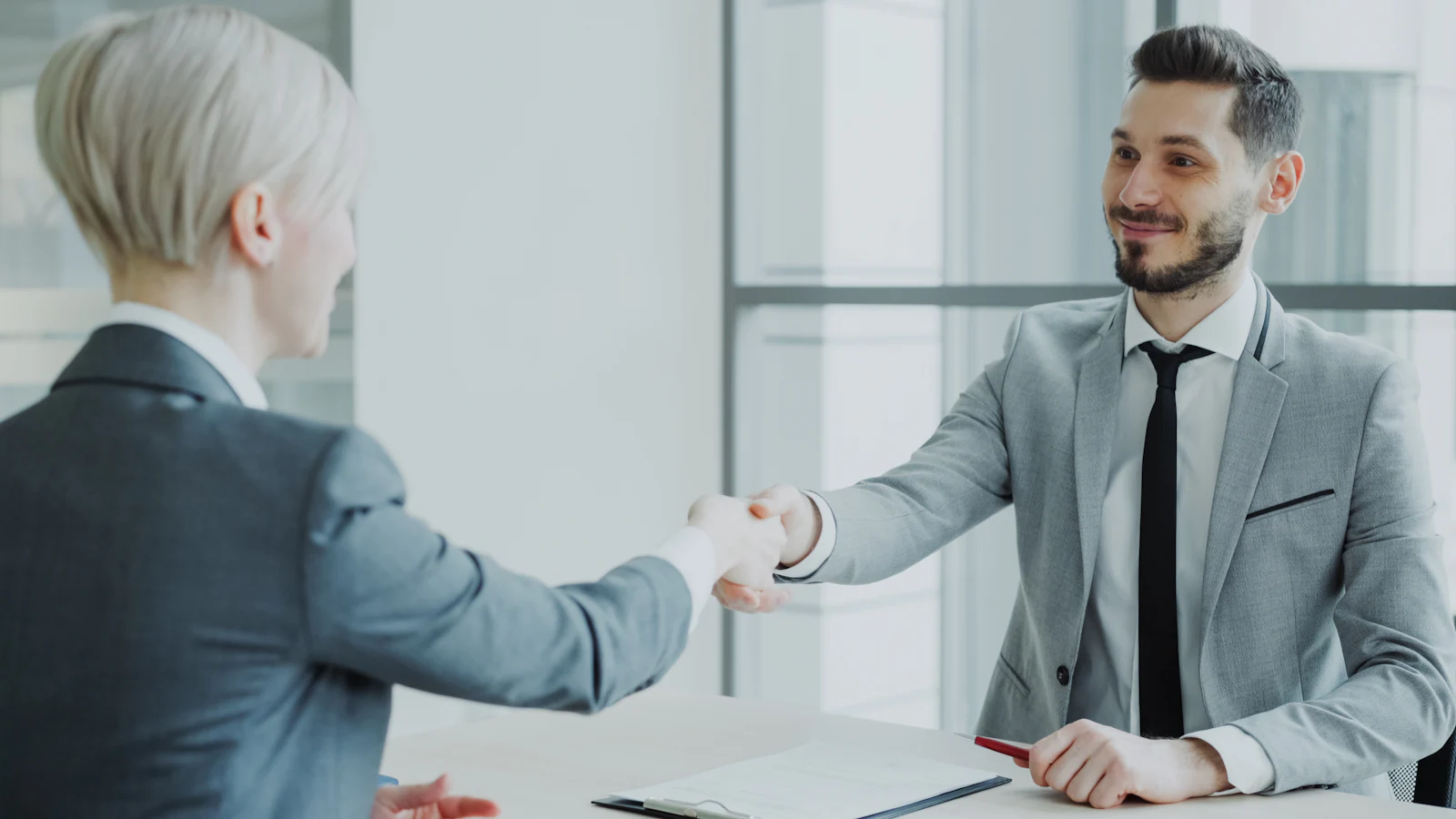 Client partnership handshake at Amber Mint Toronto