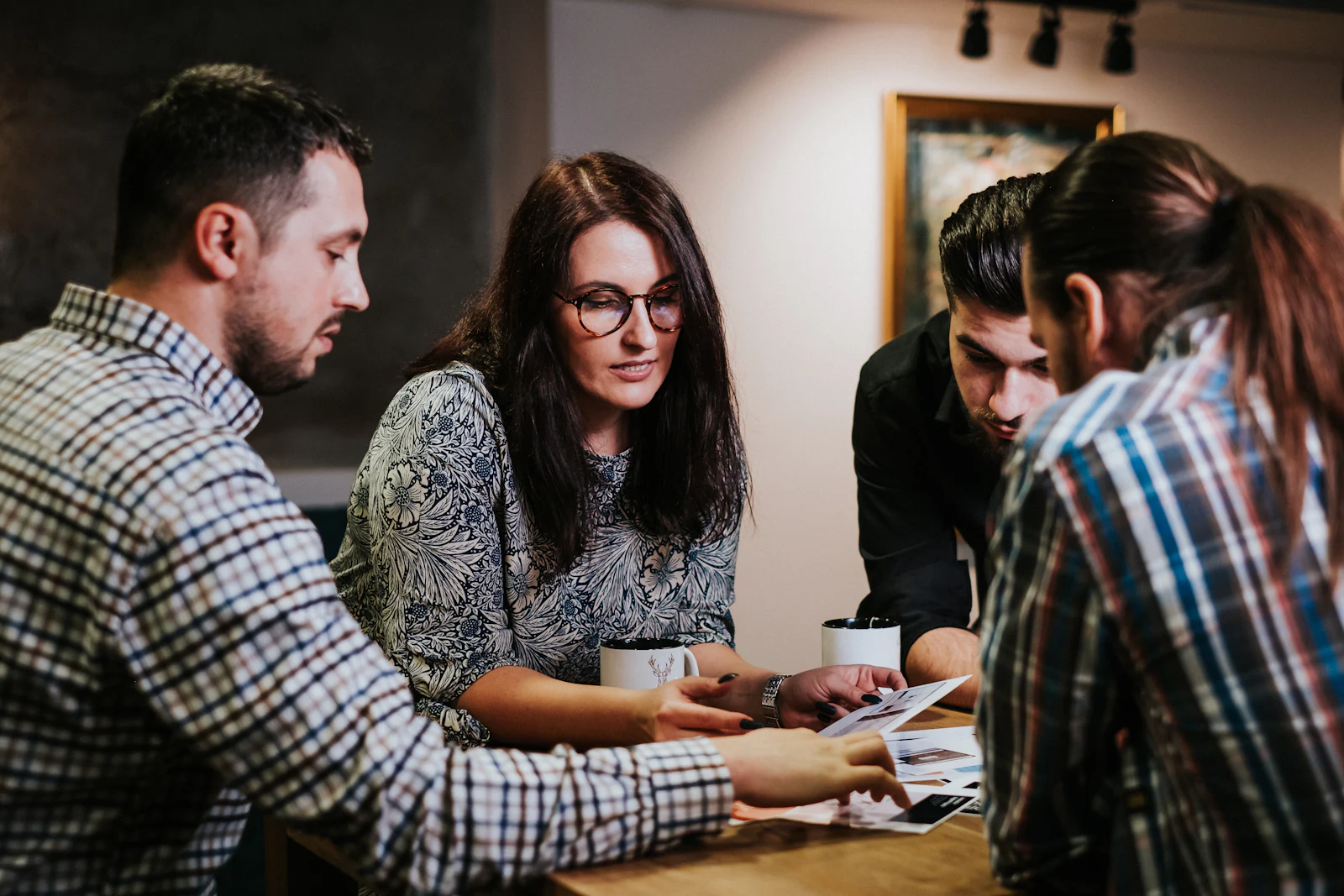 Team strategizing a marketing plan around a table