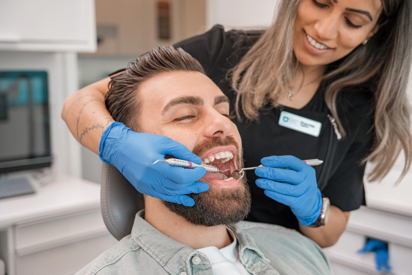 Dentist with a smiling patient in a modern clinic